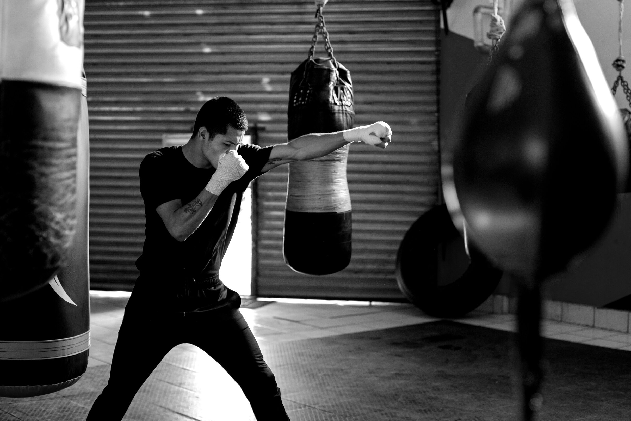 Man Shadow Boxing on a Boxing Gym 